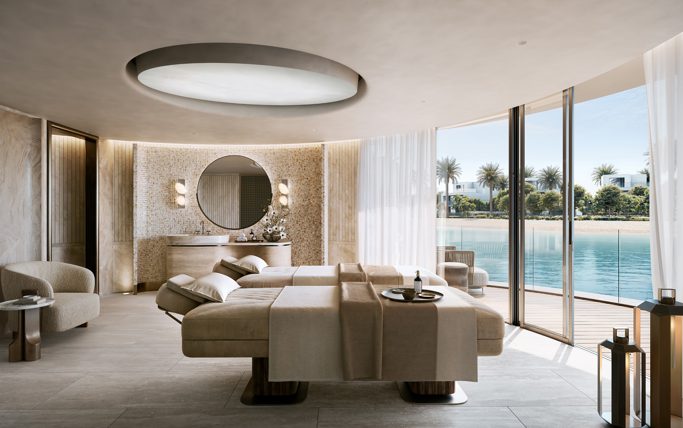 Twin treatment beds in a spa room opening onto the lake